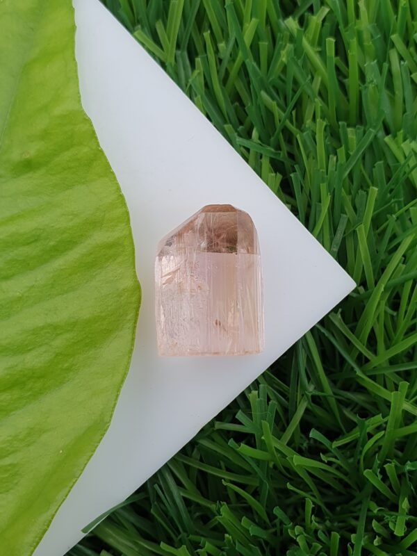 raw imperial topaz crystal from katlang. Pinkish orange
