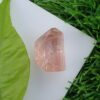 raw imperial topaz crystal from katlang. Pinkish orange