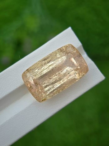 Large natural imperial topaz gemstone (60.56 ct) in yellow color, cushion cut from Katlang, Pakistan.