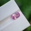 A photo of a pink sapphire from Afghanistan with oval mixed cut shape and transparent clarity on a white background | 2.62 ct | GGI certified