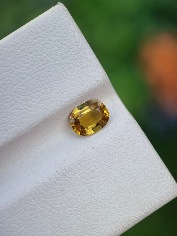 natural Epidote gemstone with a brownish-yellow color and oval shape | 0.61 ct