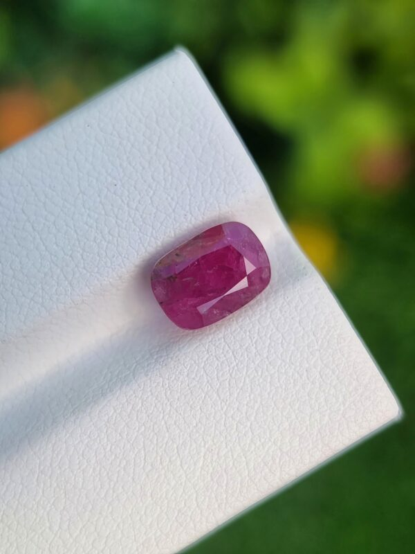 3.40 ct natural Afghan Ruby in a deep purplish red, cushion-cut to perfection, embodying untouched elegance.