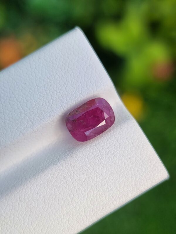 3.40 ct natural Afghan Ruby in a deep purplish red, cushion-cut to perfection, embodying untouched elegance.