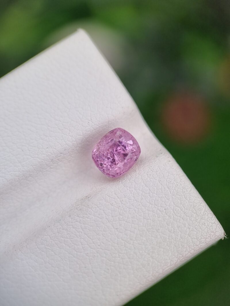 1.60 ct cushion cut pink natural Imperial Topaz, with natural inclusions, showcasing the unspoiled beauty of Katlang, Pakistan’s gemstones, untreated.