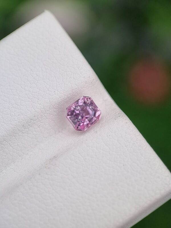 0.90 ct emerald cut pink natural Imperial Topaz, showcasing the untouched beauty of Katlang, Pakistan, untreated.