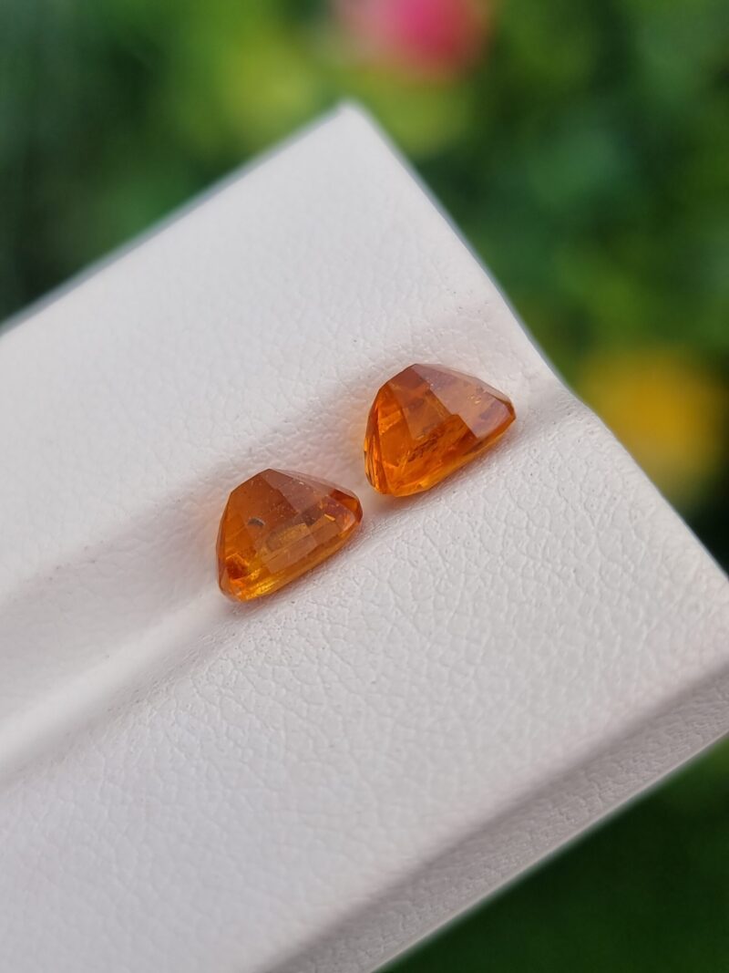 Rare Natural Clinohumite pair, cushion cut gemstones from Tajikistan with vibrant orange hues