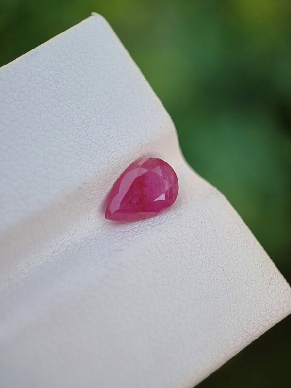 Pear-shaped Natural Ruby gemstone, purplish-red in color, from Jegdalak, Afghanistan.