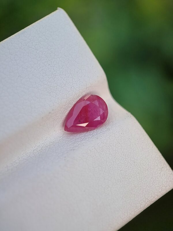 Pear-shaped Natural Ruby gemstone, purplish-red in color, from Jegdalak, Afghanistan.