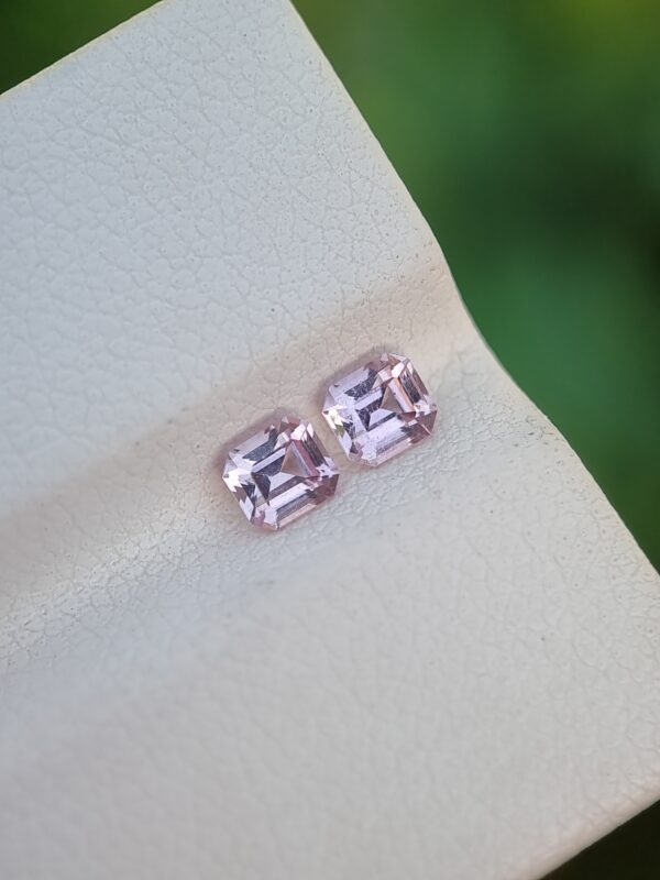 Two matching Natural Pink Topaz gemstones, light pink in color, emerald cut, from Katlang, Pakistan.