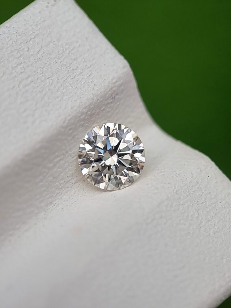 0.50 ct Round Brilliant Cut Natural Diamond - J Color, SI1 Clarity, Strong Blue Fluorescence