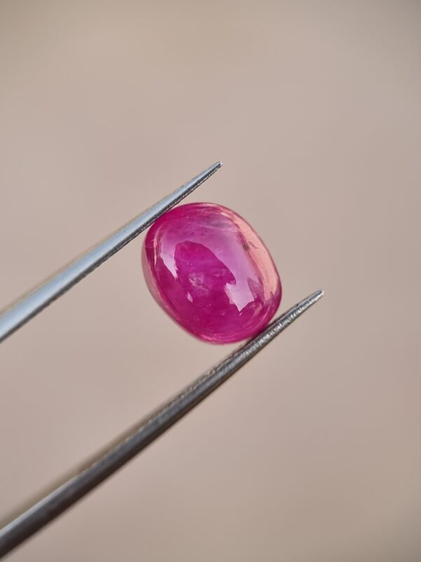 3.16-carat natural pinkish-red oval cabochon ruby from Afghanistan