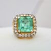 9K white gold ring with 8.00 ct Colombian emerald and 24 natural diamonds