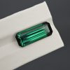 9.24 carat emerald cut bluish green tourmaline gemstone with dark contrast from Afghanistan
