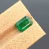 a 2.40 ct natural emerald from Swat, Pakistan. The stone has a classic emerald cut and a green color with visible inclusions.