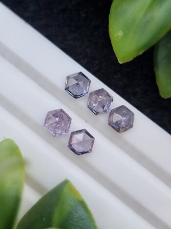 Five hexagonal natural spinel stones in varying shades of purple and violet, untreated and calibrated, from Badakhshan, Afghanistan