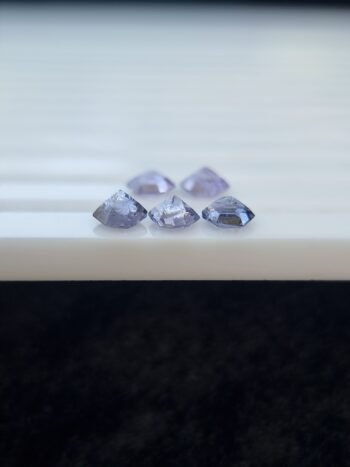 Five hexagonal natural spinel stones in varying shades of purple and violet, untreated and calibrated, from Badakhshan, Afghanistan
