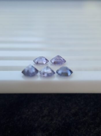 Five hexagonal natural spinel stones in varying shades of purple and violet, untreated and calibrated, from Badakhshan, Afghanistan