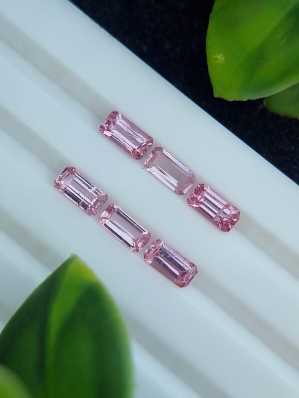 Calibrated natural pink spinel lot, emerald cut, 2.39 ct from Tajikistan, untreated and clear.