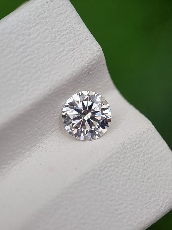 0.55ct Round Brilliant Cut Natural Diamond - J Color, SI2 Clarity, Strong Blue Fluorescence