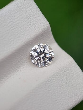 0.55ct Round Brilliant Cut Natural Diamond - J Color, SI2 Clarity, Strong Blue Fluorescence