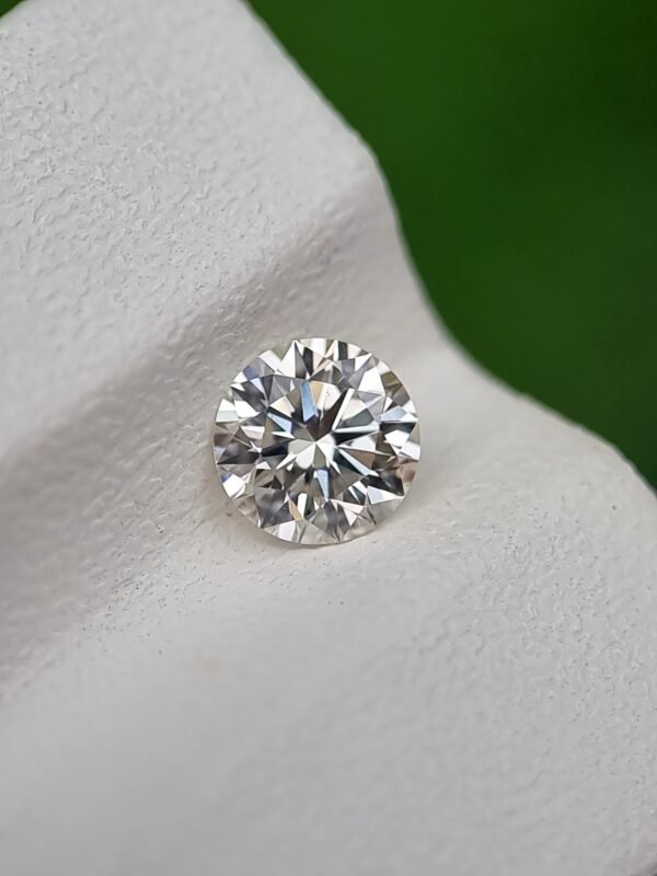 0.50 ct Round Brilliant Cut Natural Diamond - J Color, SI1 Clarity, Strong Blue Fluorescence