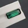 9.24 carat emerald cut bluish green tourmaline gemstone with dark contrast from Afghanistan