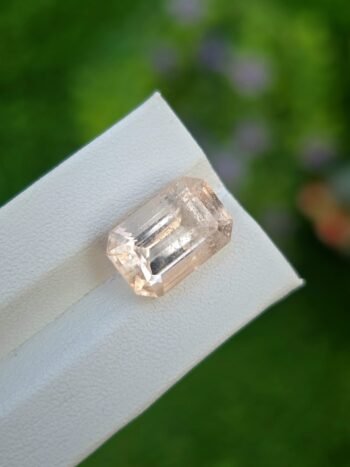 Natural 8.30 ct light orangish yellow Imperial Topaz gemstone from Katlang, emerald cut
