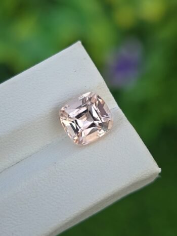 Natural Light Pinkish Orange Imperial Topaz 3.30 ct cushion cut from Katlang Pakistan, transparent with slight inclusions
